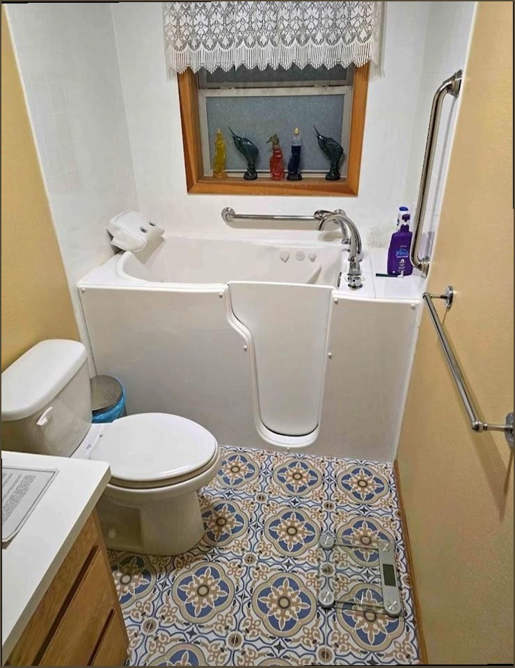 Walk-in tub installation with grab bars