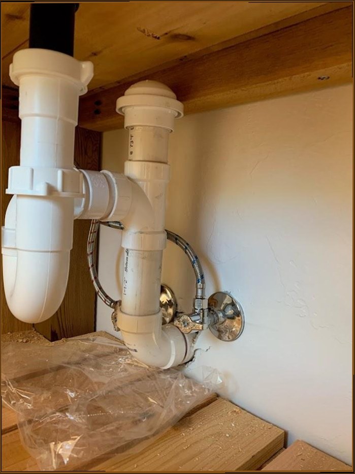 Under-sink plumbing installation